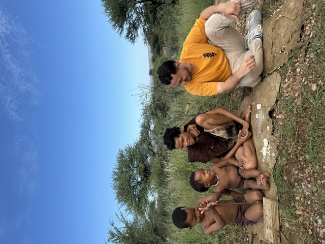 Sitting with a local family in Namibia Sitting with a local family in Namibia