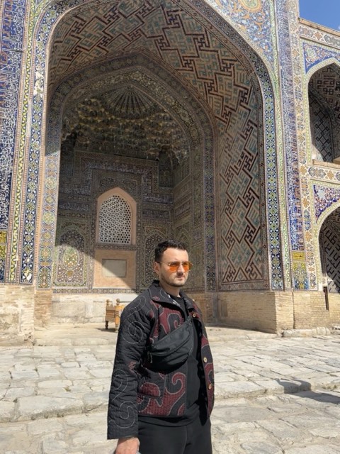 In front of a tiled facade in Uzbekistan In front of a tiled facade in Uzbekistan
